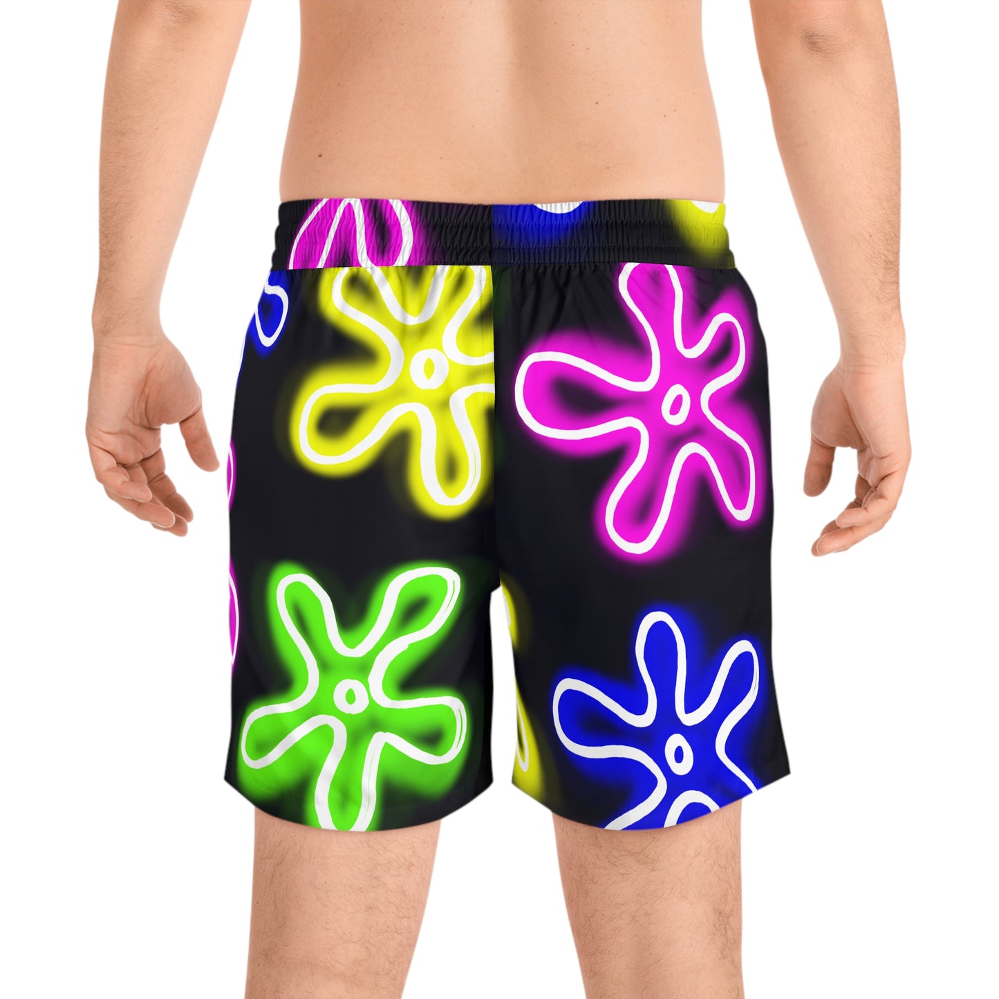 back view of a white male wearing the black and neon flower swimming trunks designed by jellyfishparty