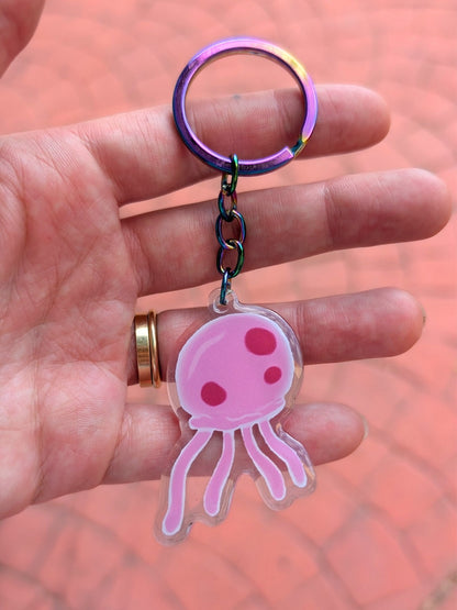 pink jellyfish keychain in hand with iridescent keyring 