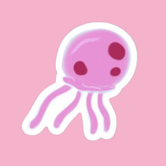 pink jellyfish underwater floating over swaying seaweed and purple coral