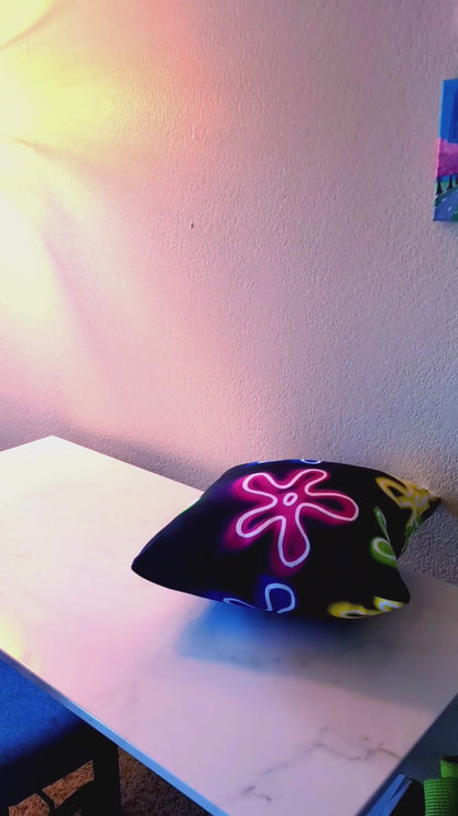 pillow with neon abstract flower pattern