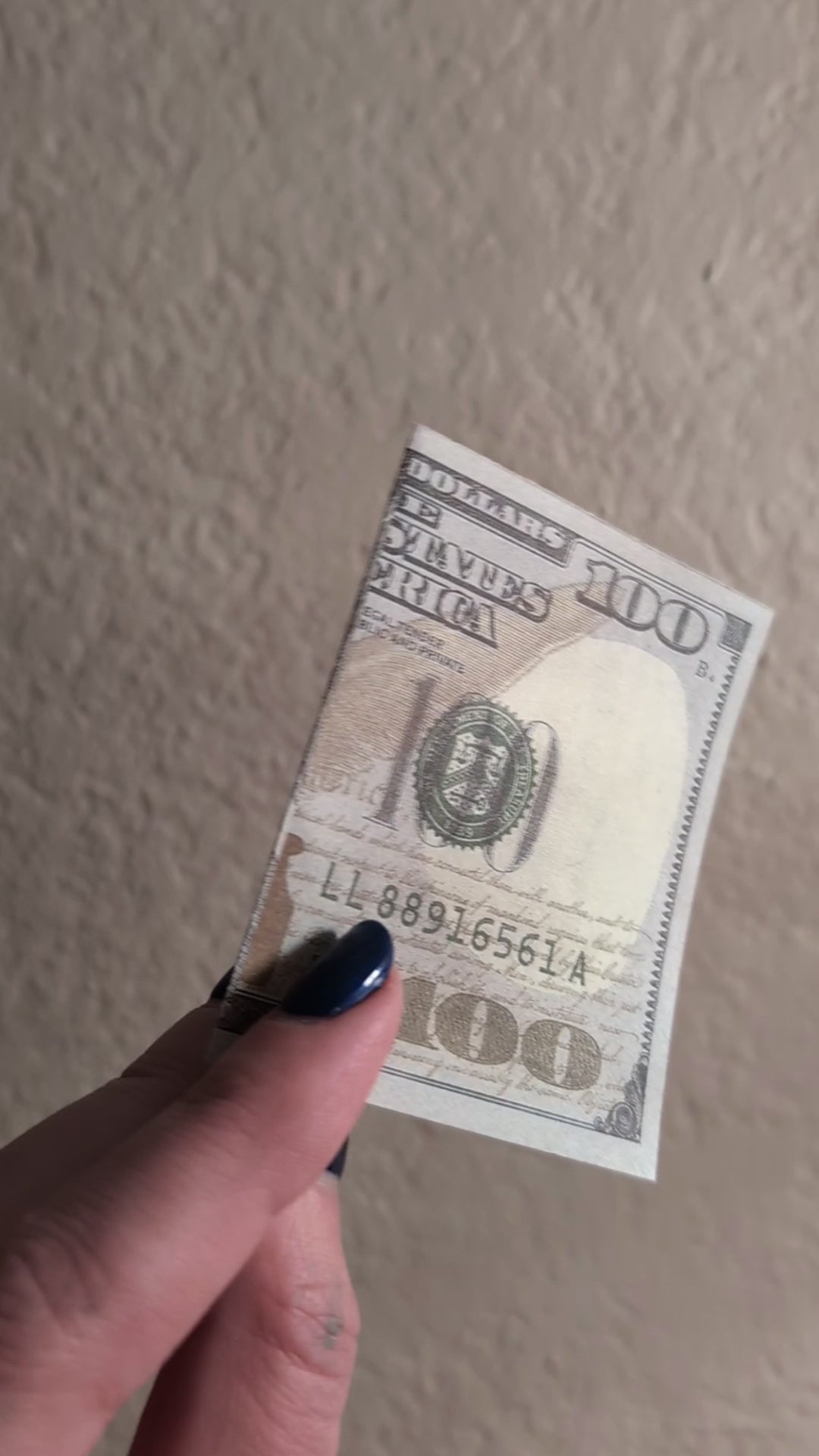 sped up dollar bill opening with smiley face inside