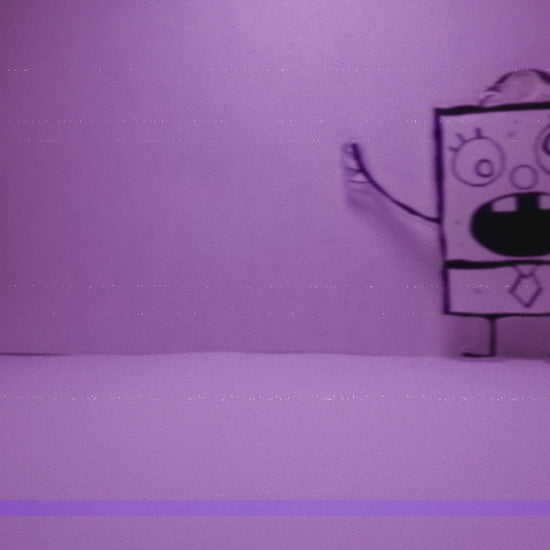 stop motion video with vcr effect of doodlebob keychain walking around a white room like it was captured on security footage