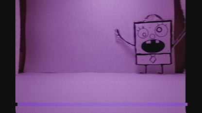 stop motion video with vcr effect of doodlebob keychain walking around a white room like it was captured on security footage