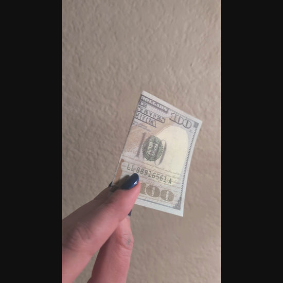 outside of one hundred dollar prank bill with smiley face inside