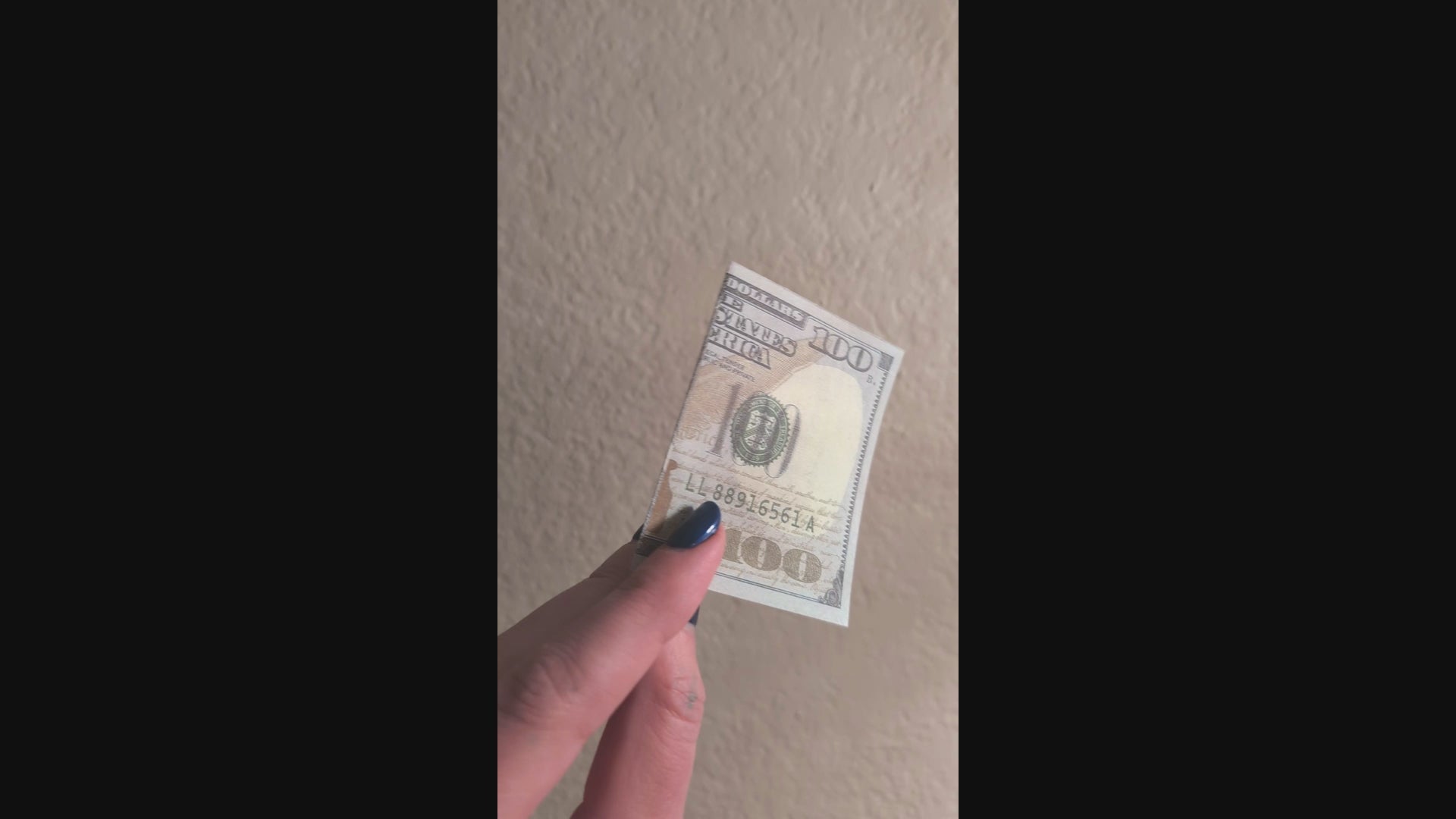 outside of one hundred dollar prank bill with smiley face inside