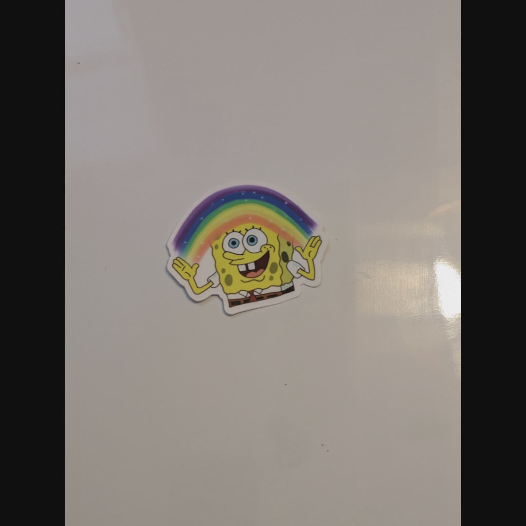 spongebob with rainbow imagination magnet thrown onto a glossy white magnetic surface