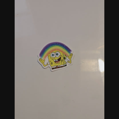 spongebob with rainbow imagination magnet thrown onto a glossy white magnetic surface