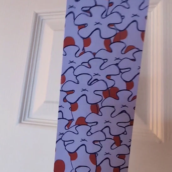 video showing both sides of purple spotted bookmark with corals