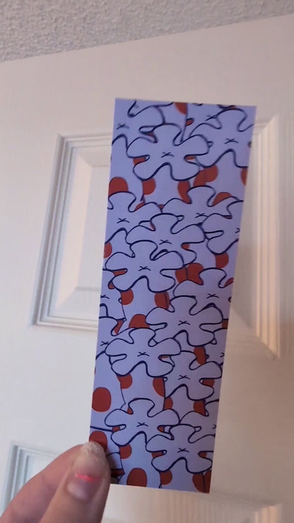 video showing both sides of purple spotted bookmark with corals