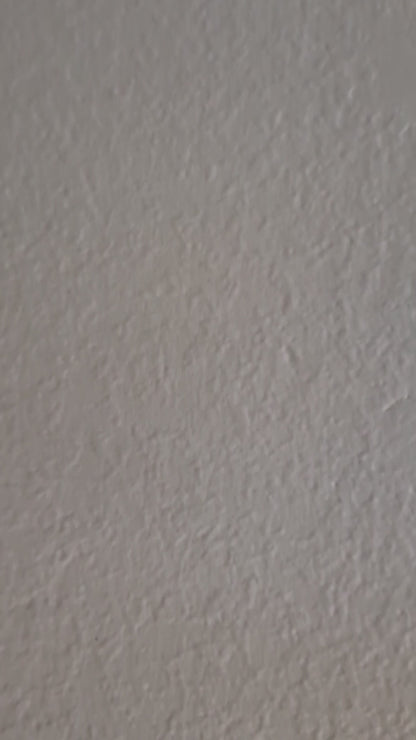 side panning video of blue window painting up close and then zoomed out