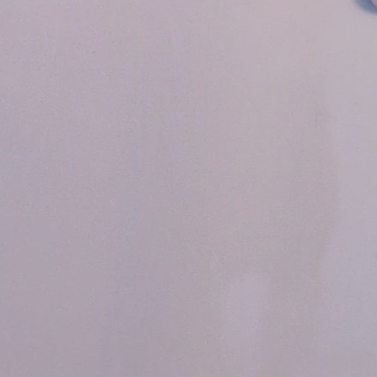 video of a bubble buddy painting magnet being thrown at a magnetic white board and sticking