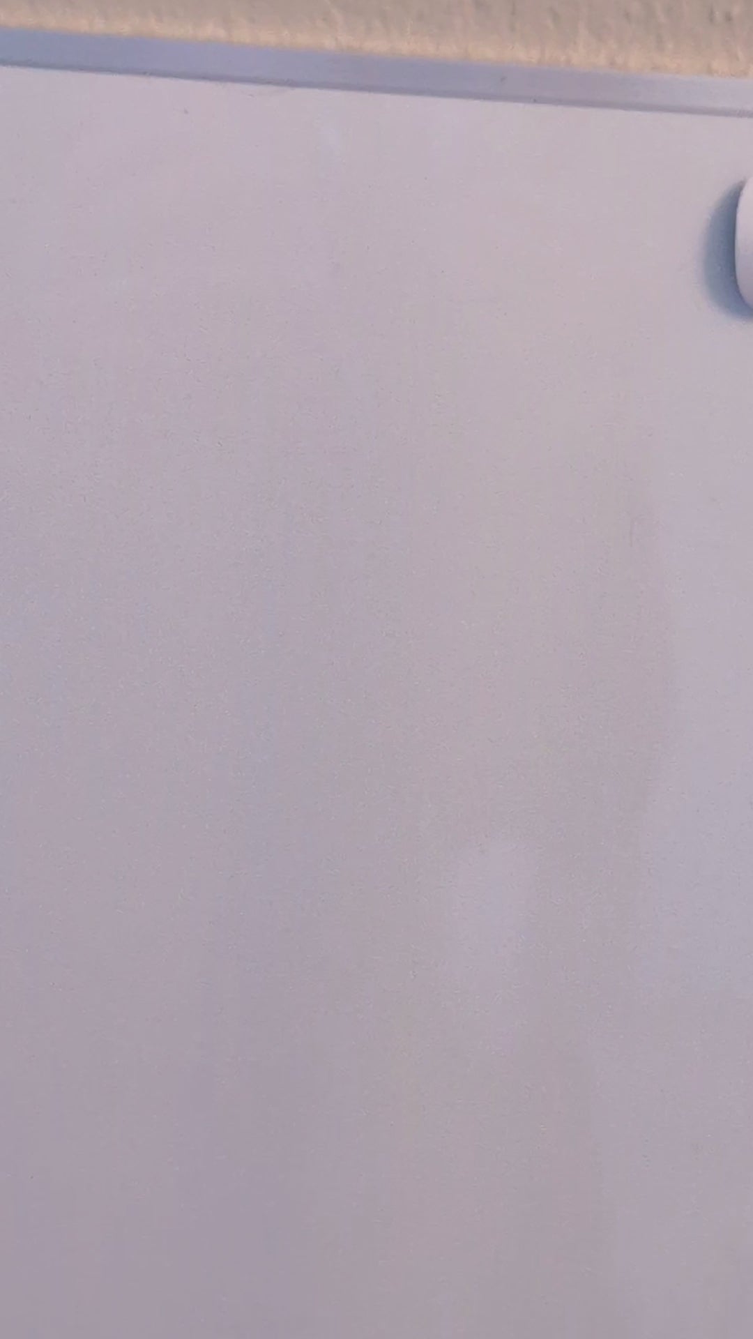 video of a bubble buddy painting magnet being thrown at a magnetic white board and sticking